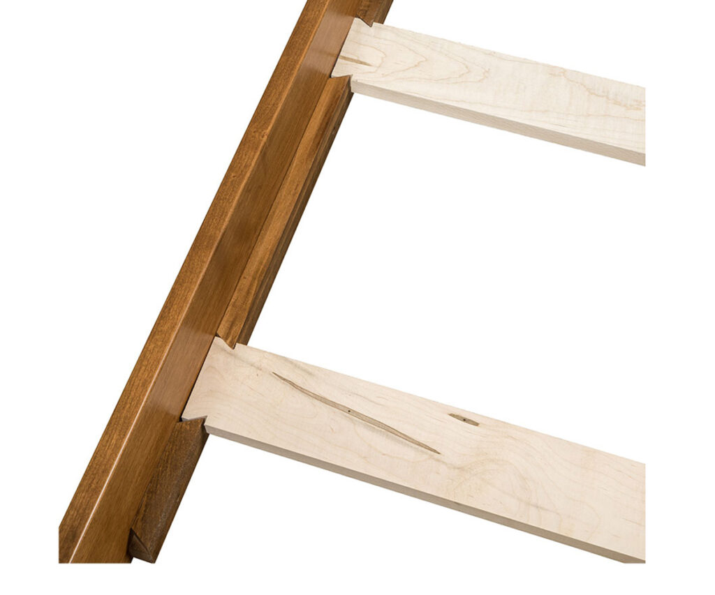dovetailed bed slat: Amish furniture joinery: dovetailed bed slat locking into side rail.