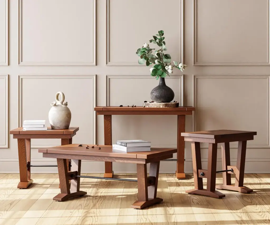 Coordinating solid wood coffee, console, and end tables against a paneled wall.