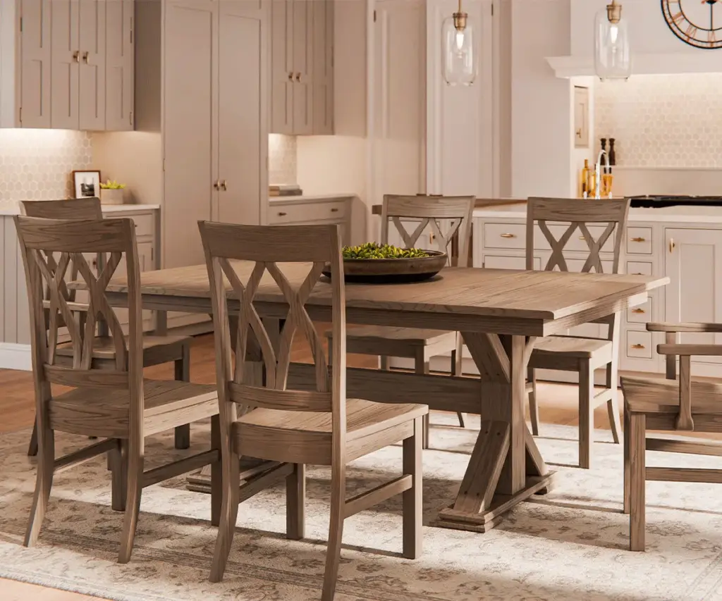 Solid wood dining table and chairs arranged in a bright kitchen.