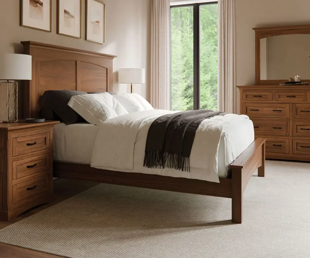 Warm wood bed, nightstand, and dresser arranged in a bright contemporary bedroom