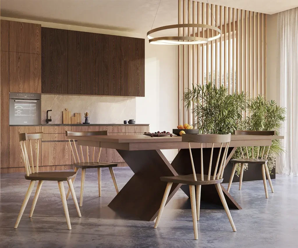 Dark wood trestle dining table with mixed wood chairs in a modern open kitchen and dining room.